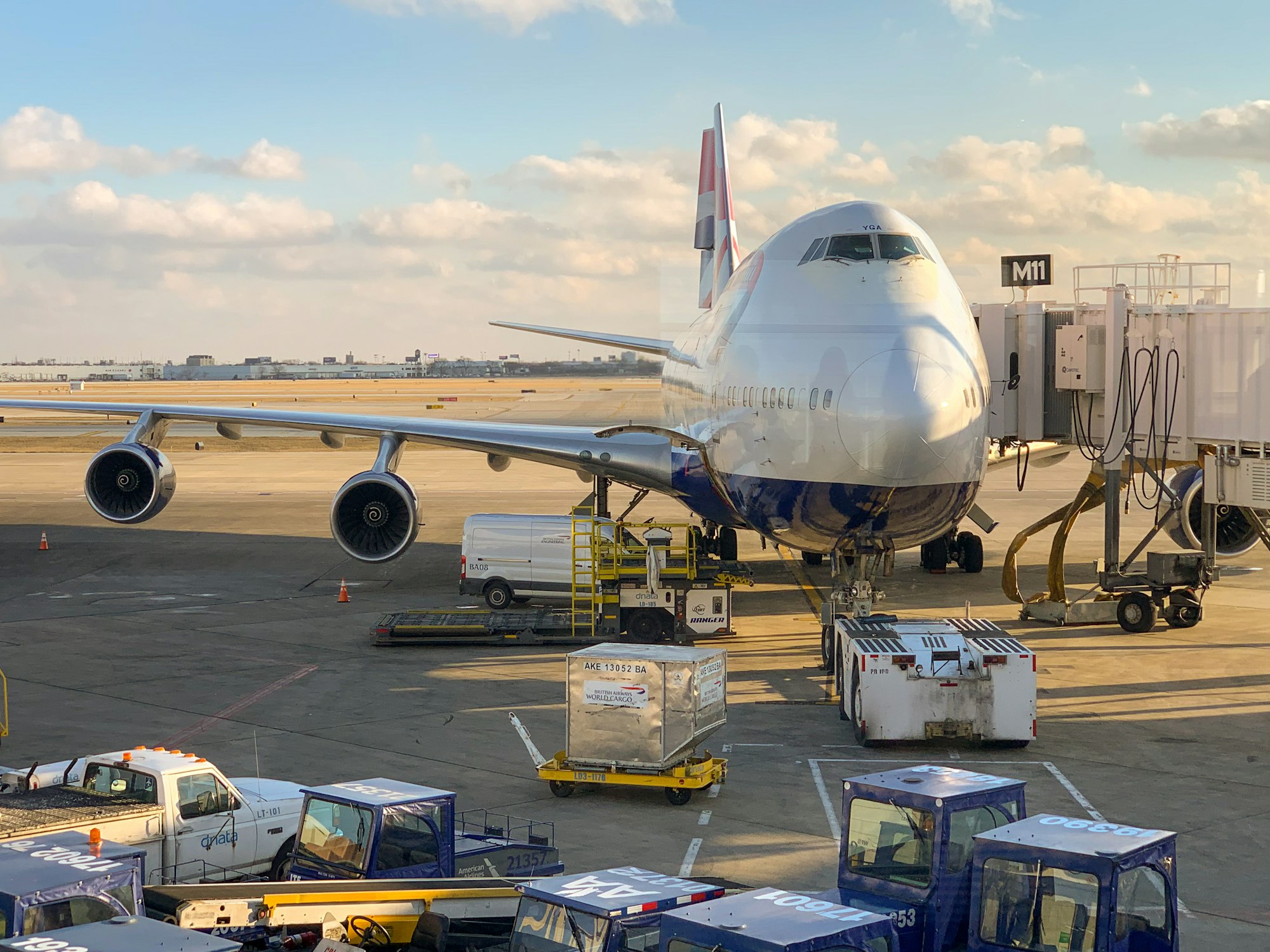 Wide-body aircraft on the tarmac with ground cargo handling equipment